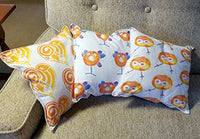 three 12" Square Pillows Orange Taino Symbols