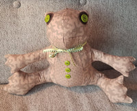 Plush toy frog, or coqui, made with coqui frog patterned cotton